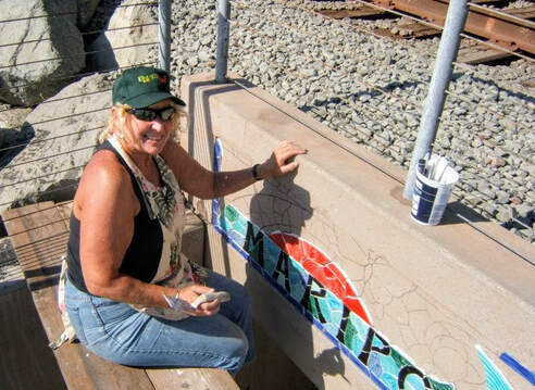 Kathryn Stovall Dennis installing a tile mosaic in San Clemente